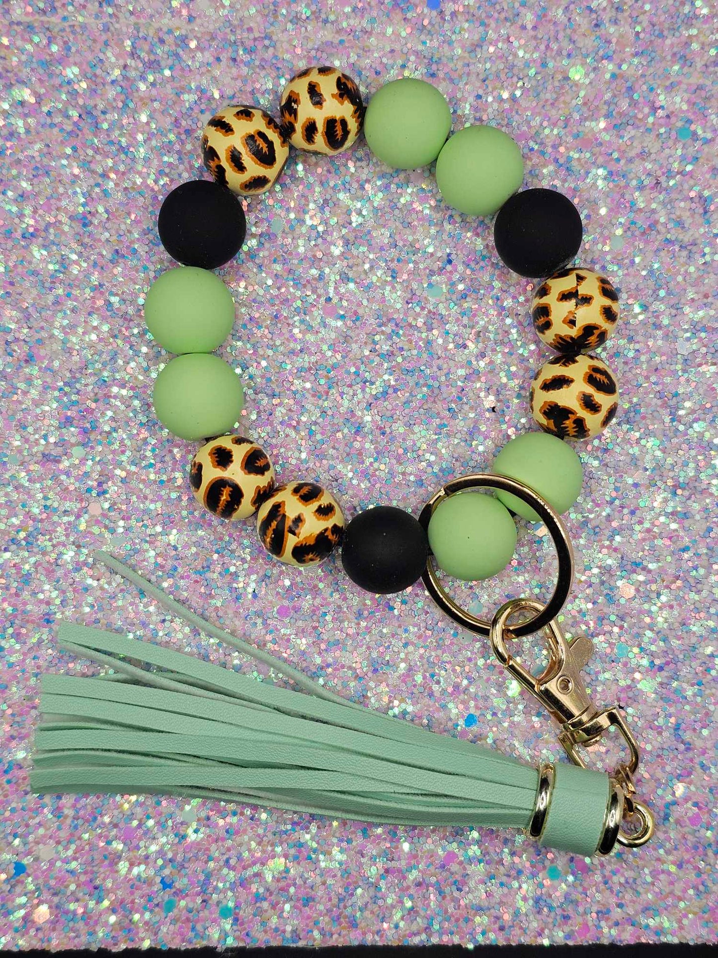 Green leopard Wristlet with green fringe