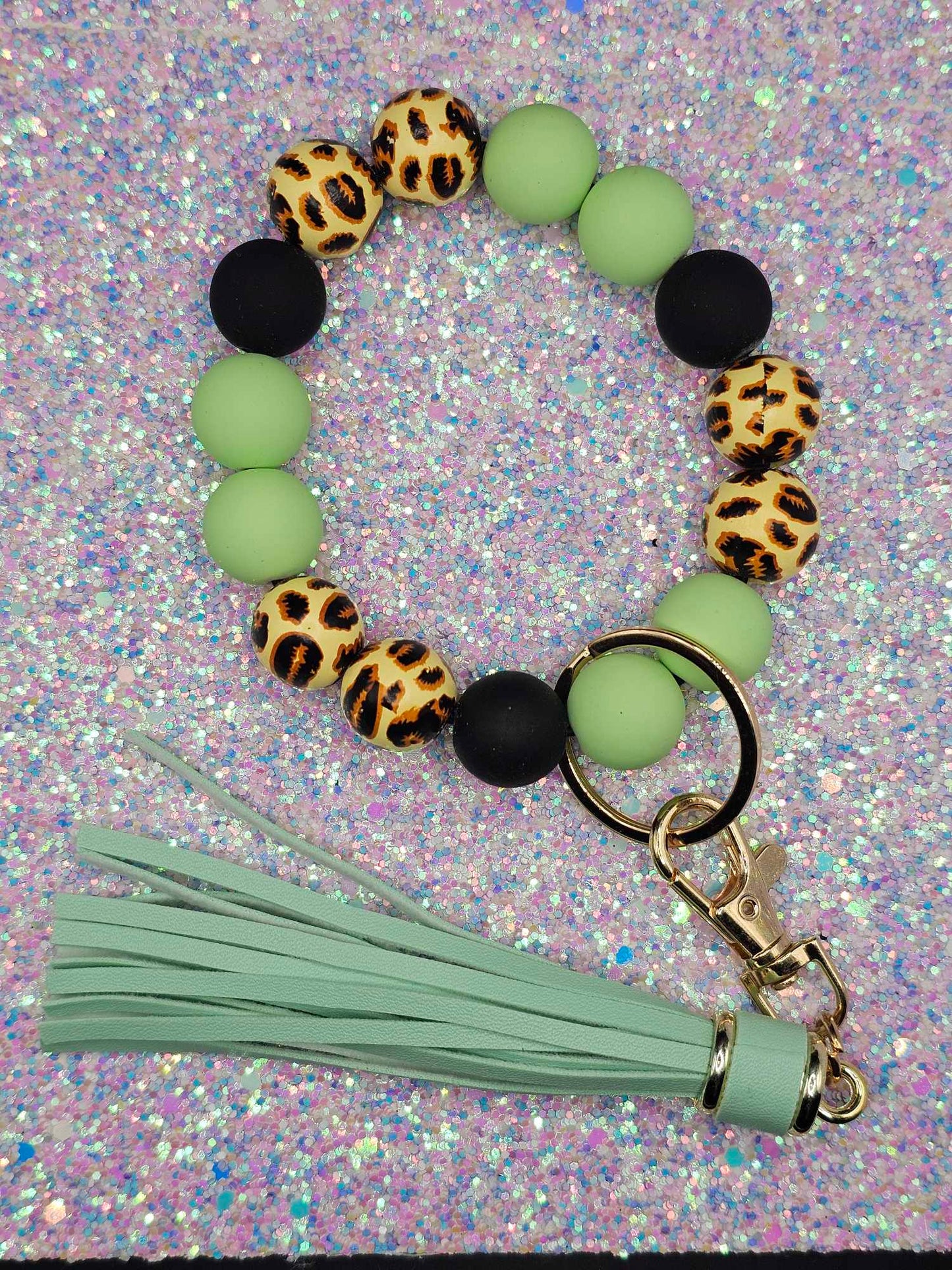 Green leopard Wristlet with green  fringe