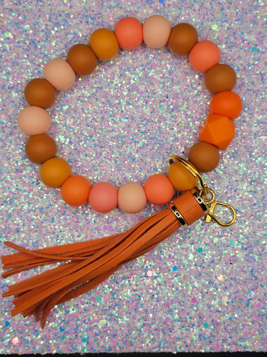 Orange Wristlet with orange fringe